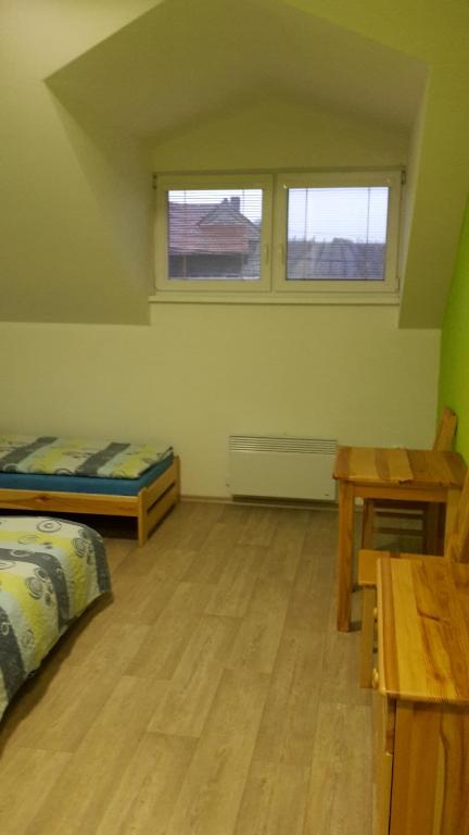Postel nebo postele na pokoji v ubytování Hospůdka U Smrku