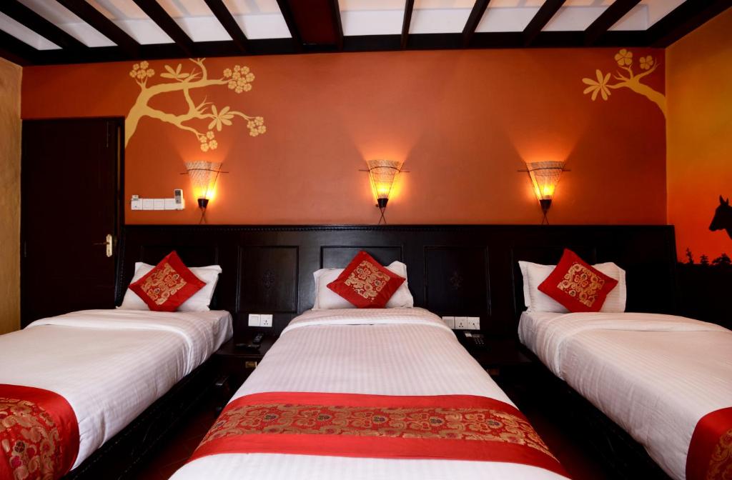 Postel nebo postele na pokoji v ubytování Kasthamandap Boutique Hotel