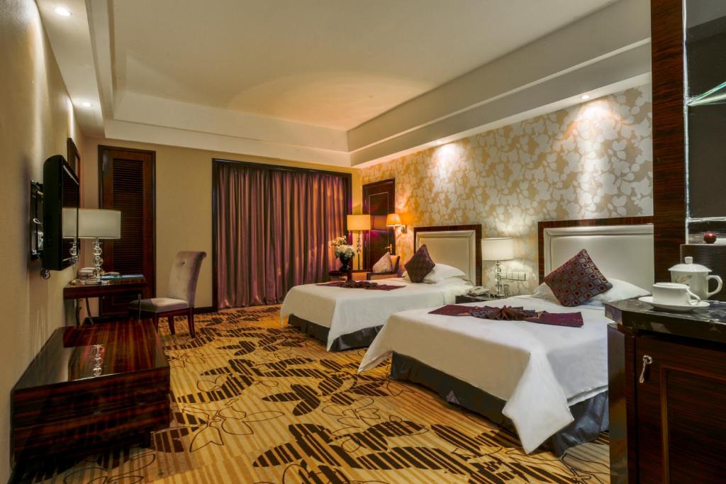 Postel nebo postele na pokoji v ubytování Country Garden Phoenix Hotel Huizhou Huiyang