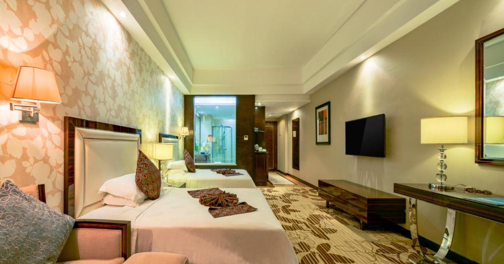 TV a/nebo společenská místnost v ubytování Country Garden Phoenix Hotel Huizhou Huiyang