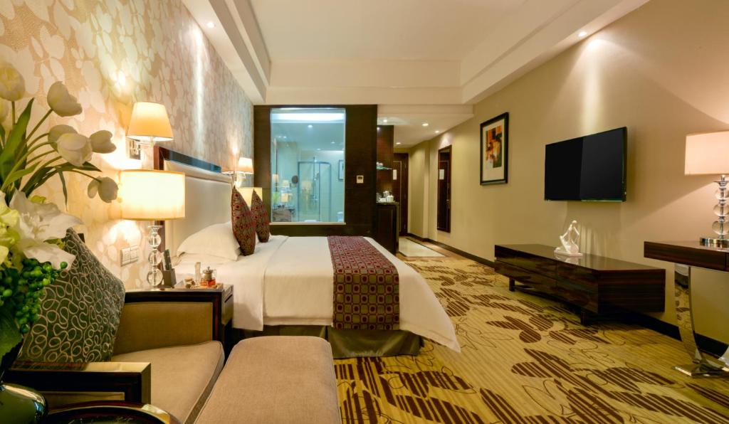 Postel nebo postele na pokoji v ubytování Country Garden Phoenix Hotel Huizhou Huiyang