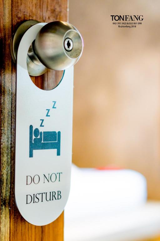 Postel nebo postele na pokoji v ubytování Ton Fang Hotel