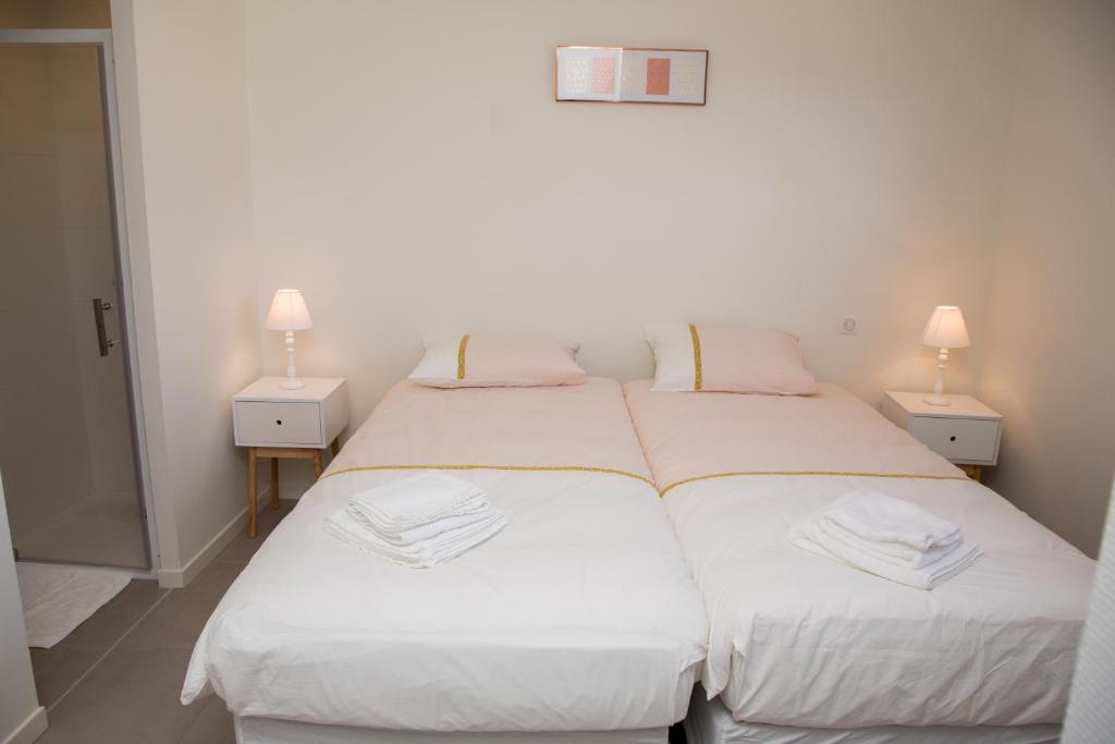 En eller flere senge i et værelse på Albipavillon