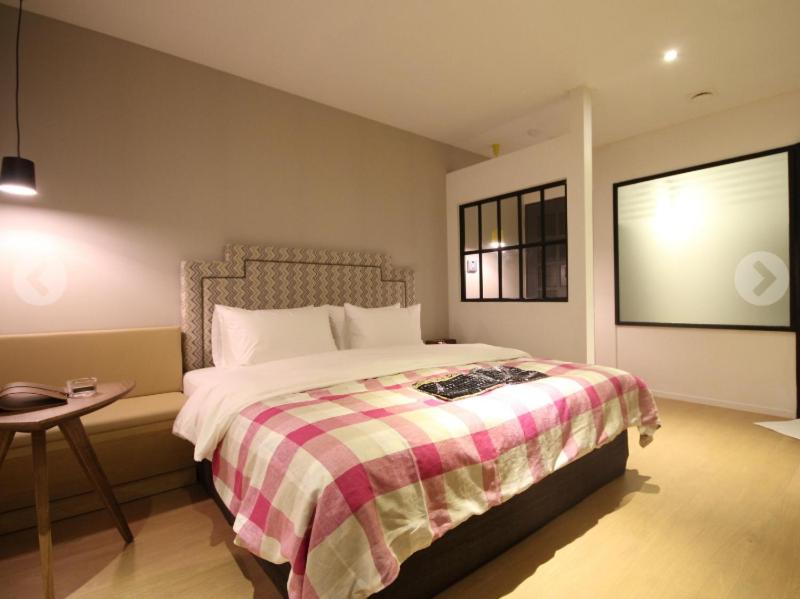 Postel nebo postele na pokoji v ubytování Hotel 25 Seomyeon