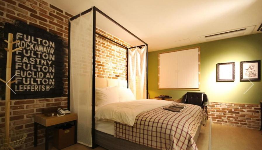 Postel nebo postele na pokoji v ubytování Hotel 25 Seomyeon