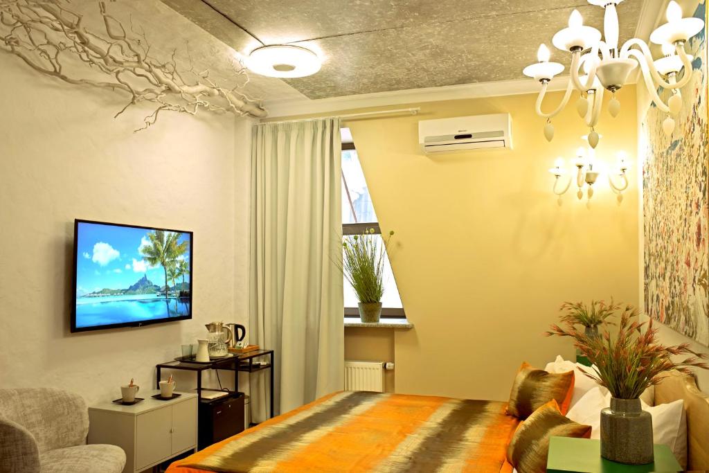 TV a/nebo společenská místnost v ubytování MaNNa Boutique Hotel