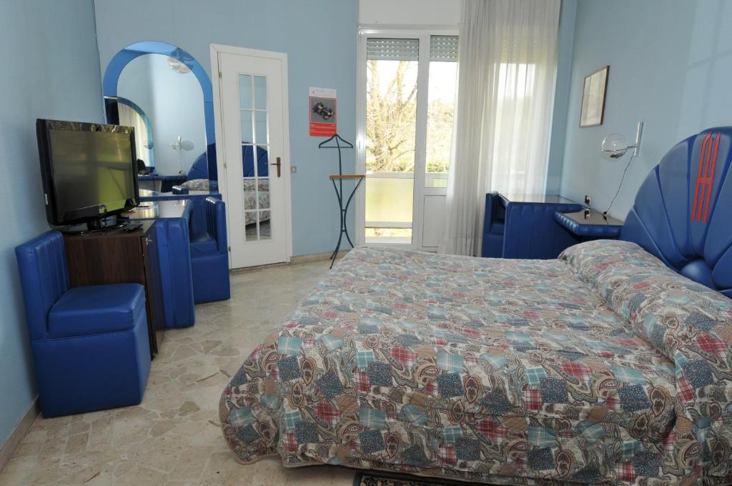 Postel nebo postele na pokoji v ubytování Hotel Fossati
