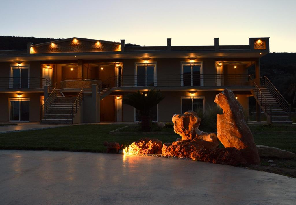 a house with a fire fountain in front of it at Marathon Eco Stay in Marathon