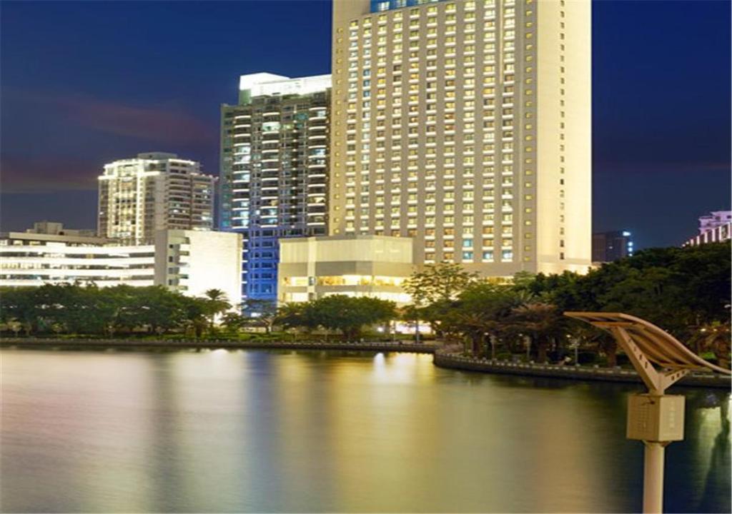 a view of a city with tall buildings and a river at Xiamen Airlines Lakeside Hotel in Xiamen