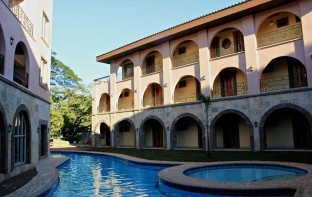 Bazén v ubytování Corto del Mar Hotel nebo v jeho okolí