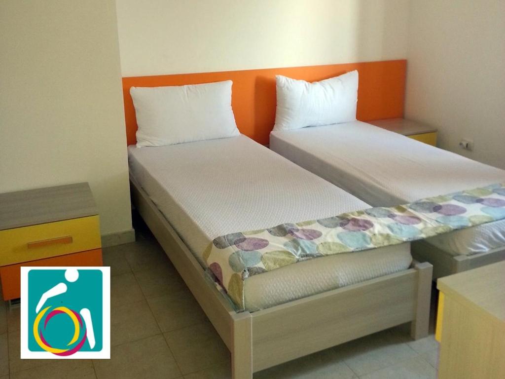 Postel nebo postele na pokoji v ubytování Ostello Bella Calabria