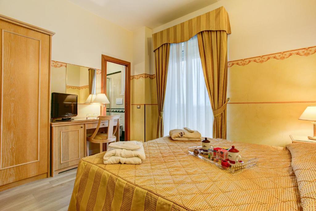 Postel nebo postele na pokoji v ubytování Hotel Byron