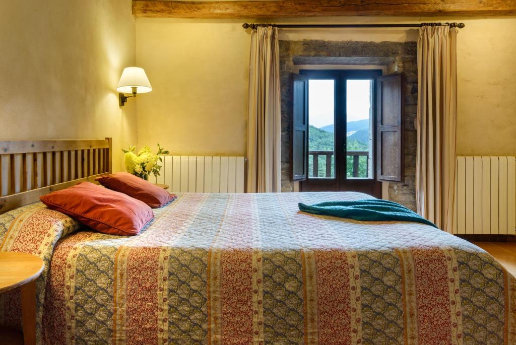 Postel nebo postele na pokoji v ubytování Hotel Akerreta