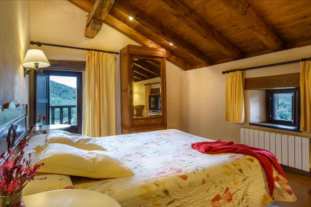 Postel nebo postele na pokoji v ubytování Hotel Akerreta