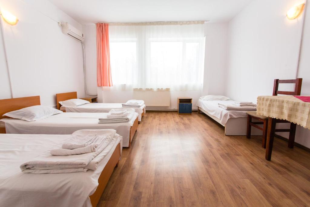Postel nebo postele na pokoji v ubytování Hostel Horia