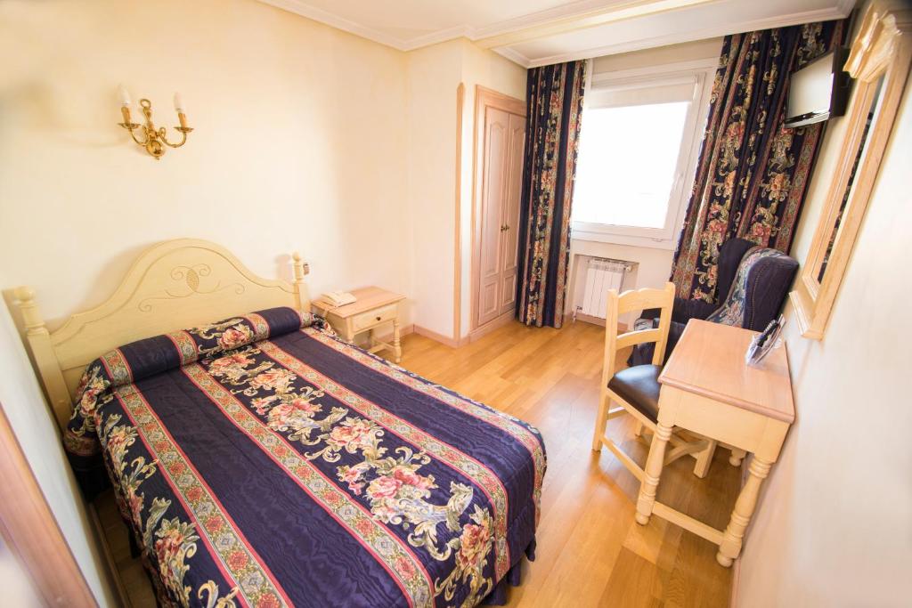 Postel nebo postele na pokoji v ubytování Hotel Julia