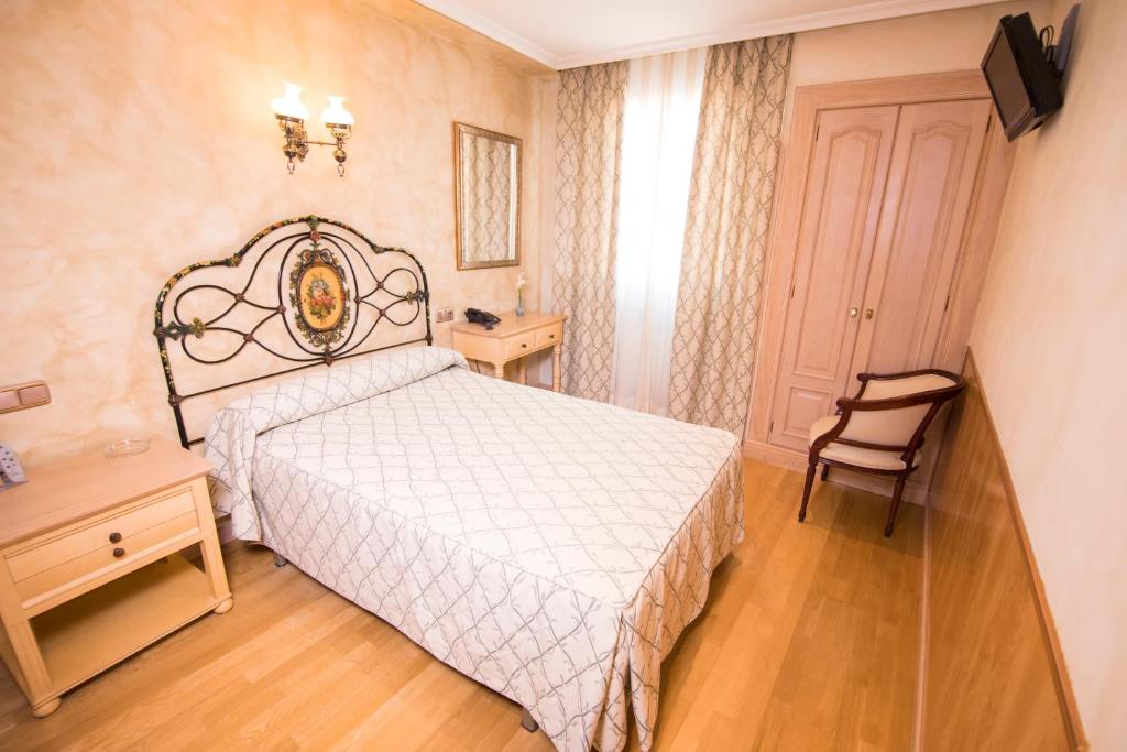 Postel nebo postele na pokoji v ubytování Hotel Julia