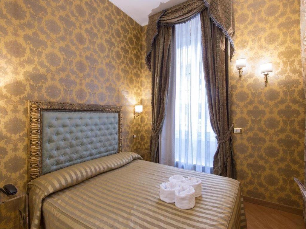 Postel nebo postele na pokoji v ubytování DCBoutiqueHotel
