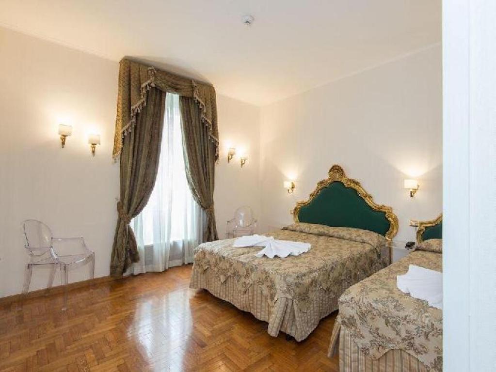 Postel nebo postele na pokoji v ubytování DCBoutiqueHotel
