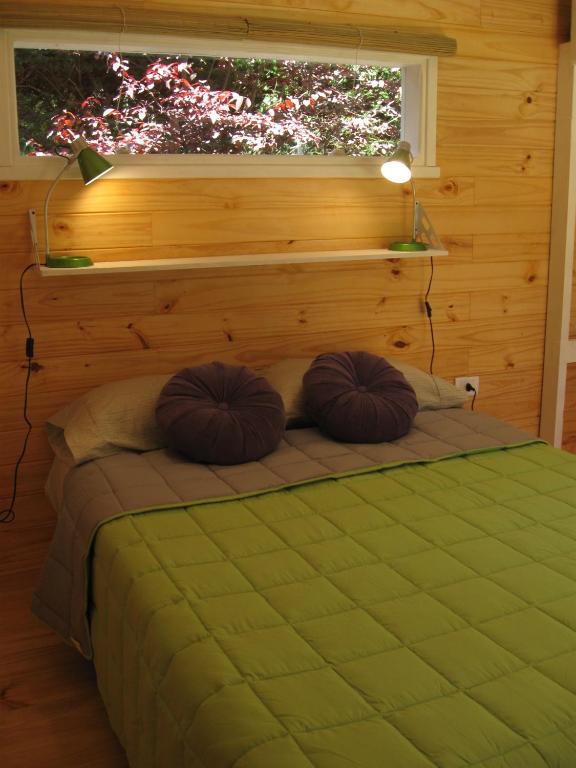 Postel nebo postele na pokoji v ubytování Dodo House