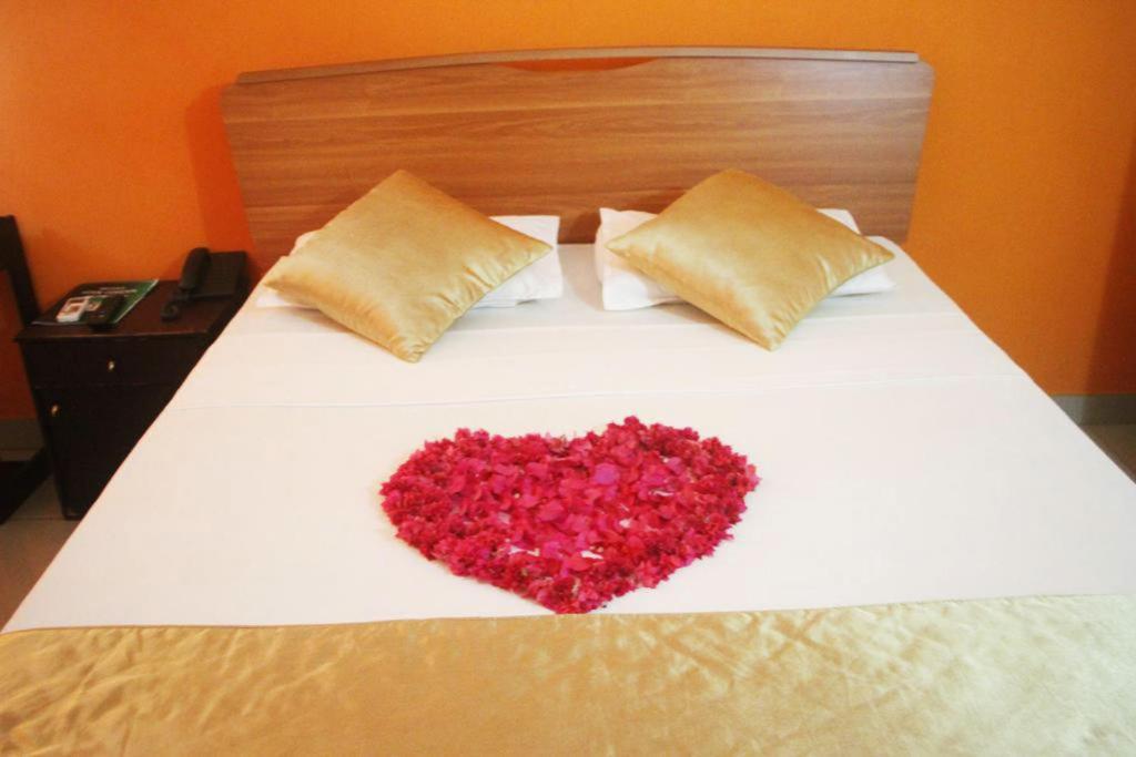 Postel nebo postele na pokoji v ubytování Hotel Eden Garden