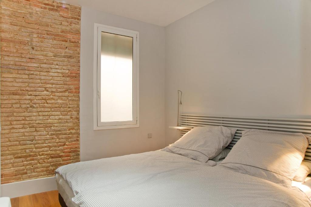 Postel nebo postele na pokoji v ubytování Montaber Apartment - Bailén
