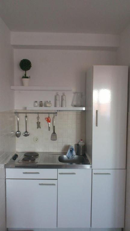 Kuchyň nebo kuchyňský kout v ubytování Apartmani Neva Supetar