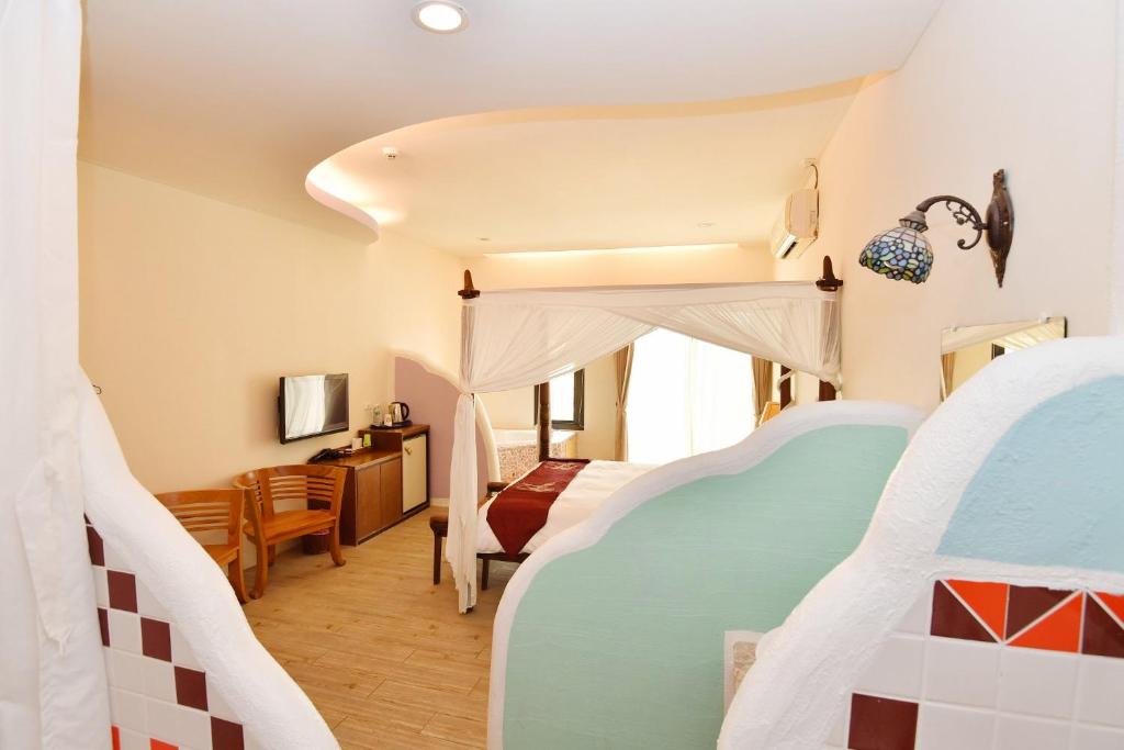 Postel nebo postele na pokoji v ubytování Rock House