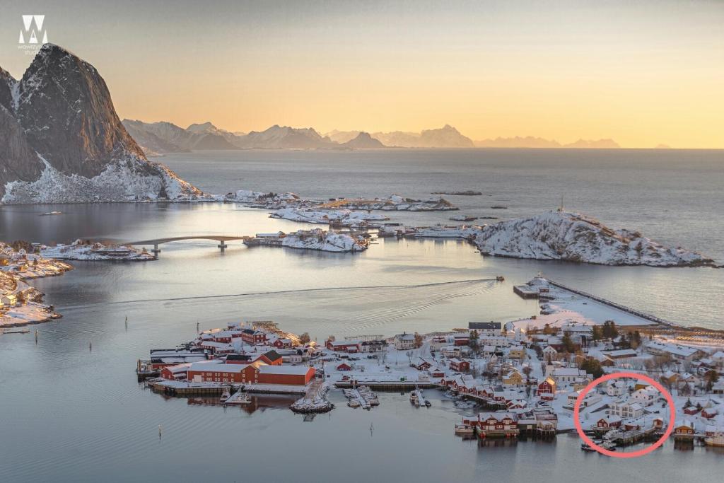 an aerial view of a small island in the water at May's Apartments by May's in Reine