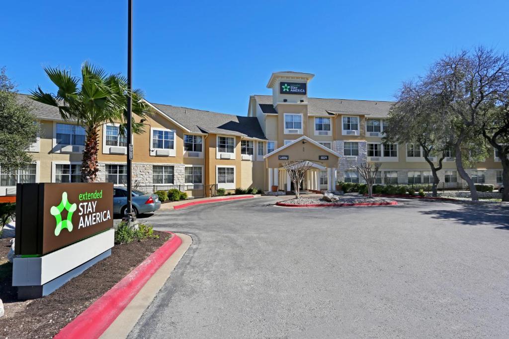 a view of a hotel with a sign in front of it at Extended Stay America Suites - Austin - North Central in Austin