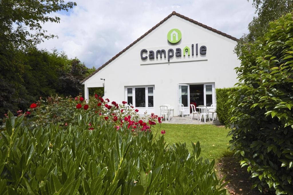 a white building with a sign on it at Campanile Arras - Saint-Nicolas in Saint-Nicolas