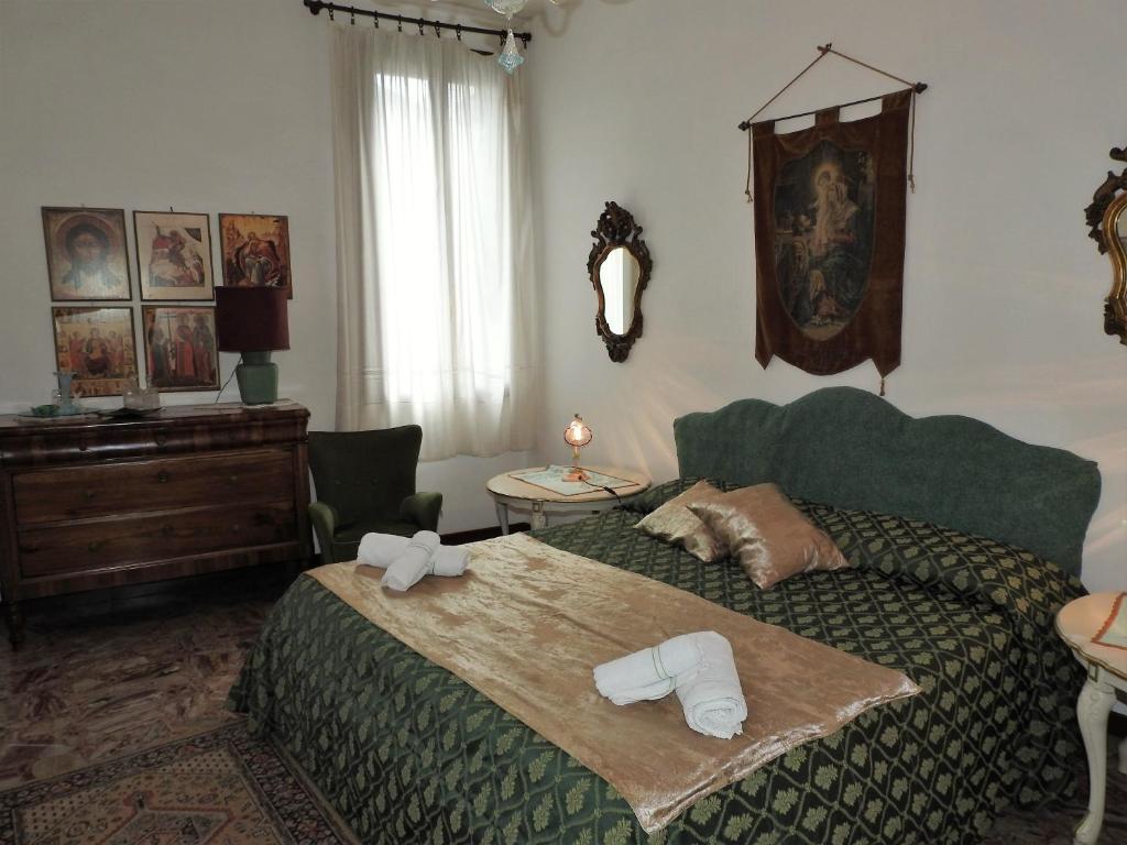 Postel nebo postele na pokoji v ubytování la poetessa