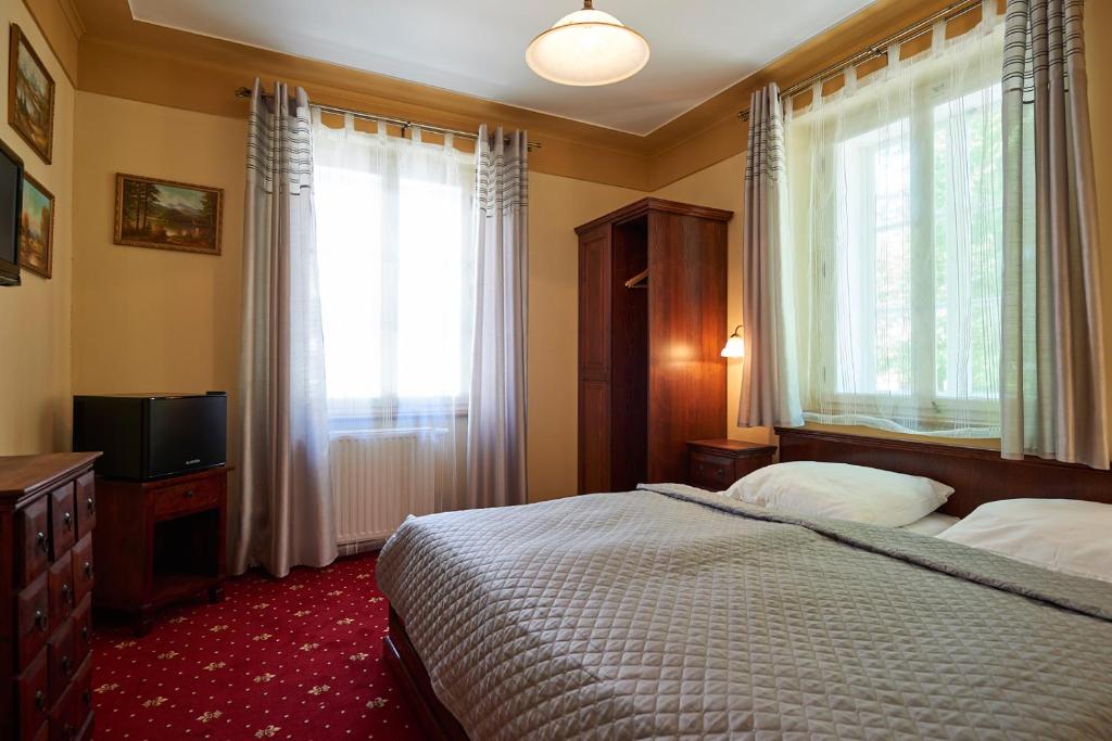 Postel nebo postele na pokoji v ubytování Hotel Stará Pekárna s privátním wellness