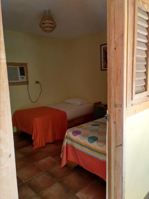 Postel nebo postele na pokoji v ubytování Hotel Loro Tuerto