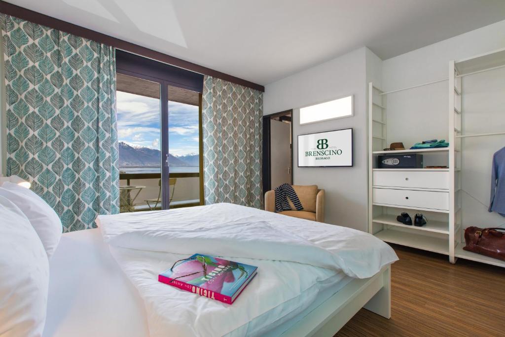 Postel nebo postele na pokoji v ubytování Parkhotel Brenscino Brissago