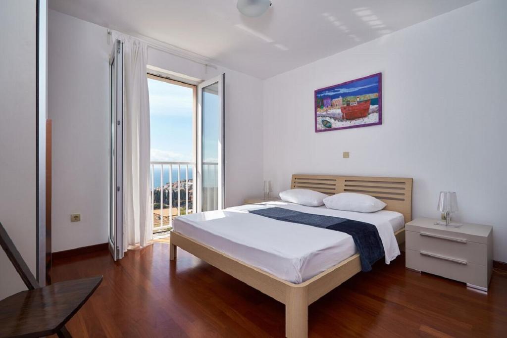 En eller flere senge i et værelse på Apartments Ranieri Kono