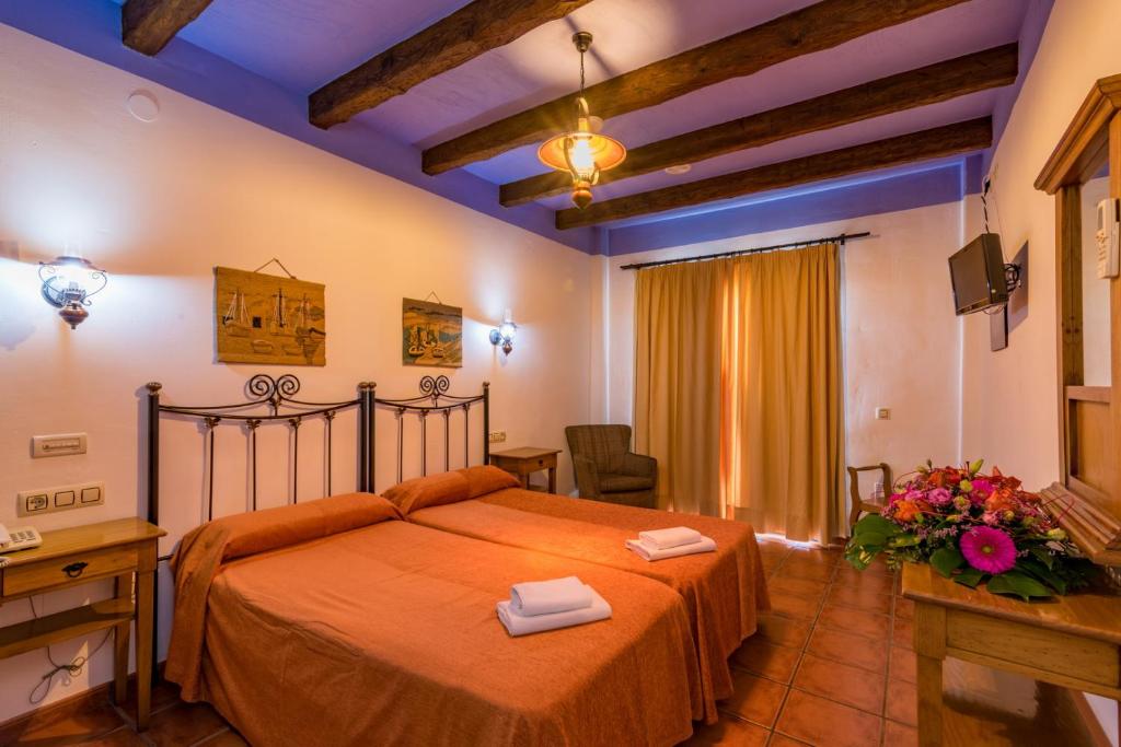 Cama o camas de una habitación en Hotel Rural Almazara