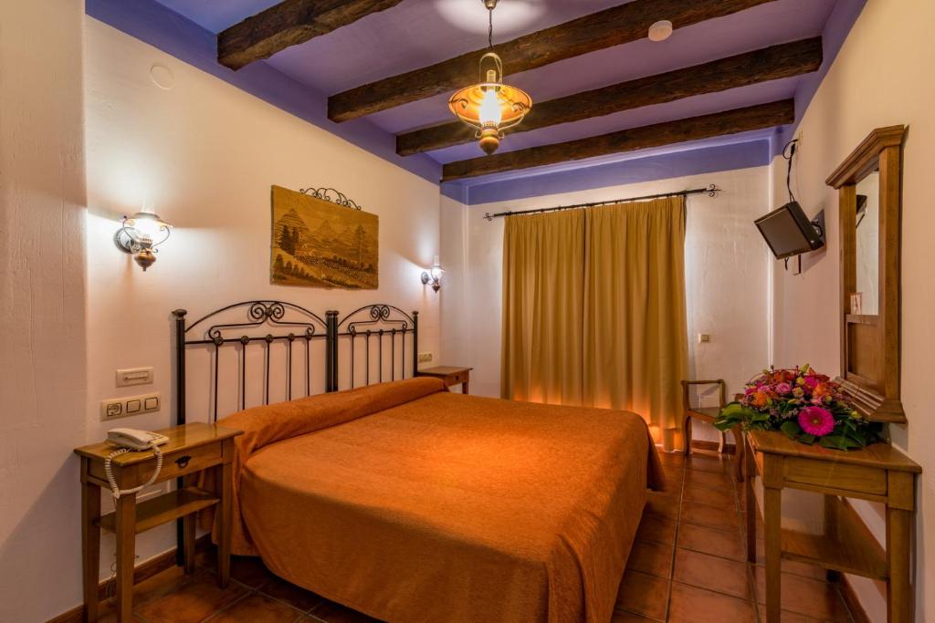 Cama o camas de una habitación en Hotel Rural Almazara
