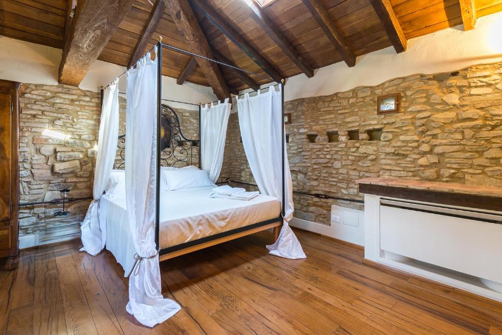 Postel nebo postele na pokoji v ubytování Borgo Cadonega