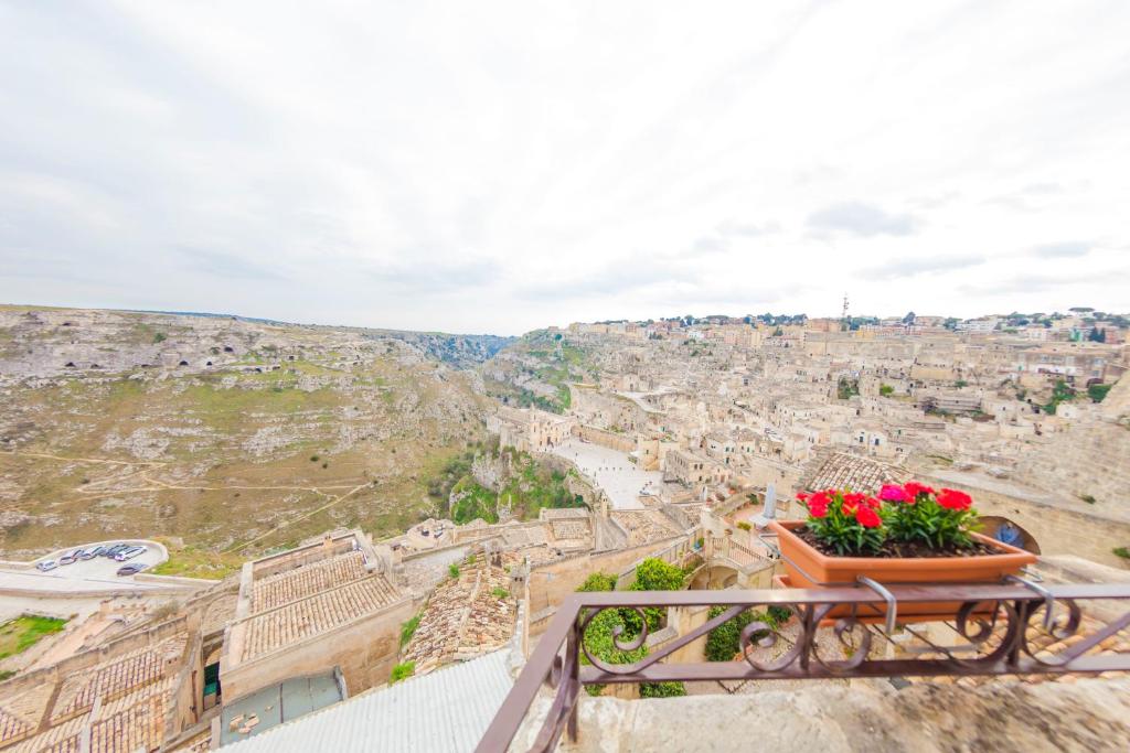 a view of the city from the balcony of a building at Dimora Santa Barbara in Matera
