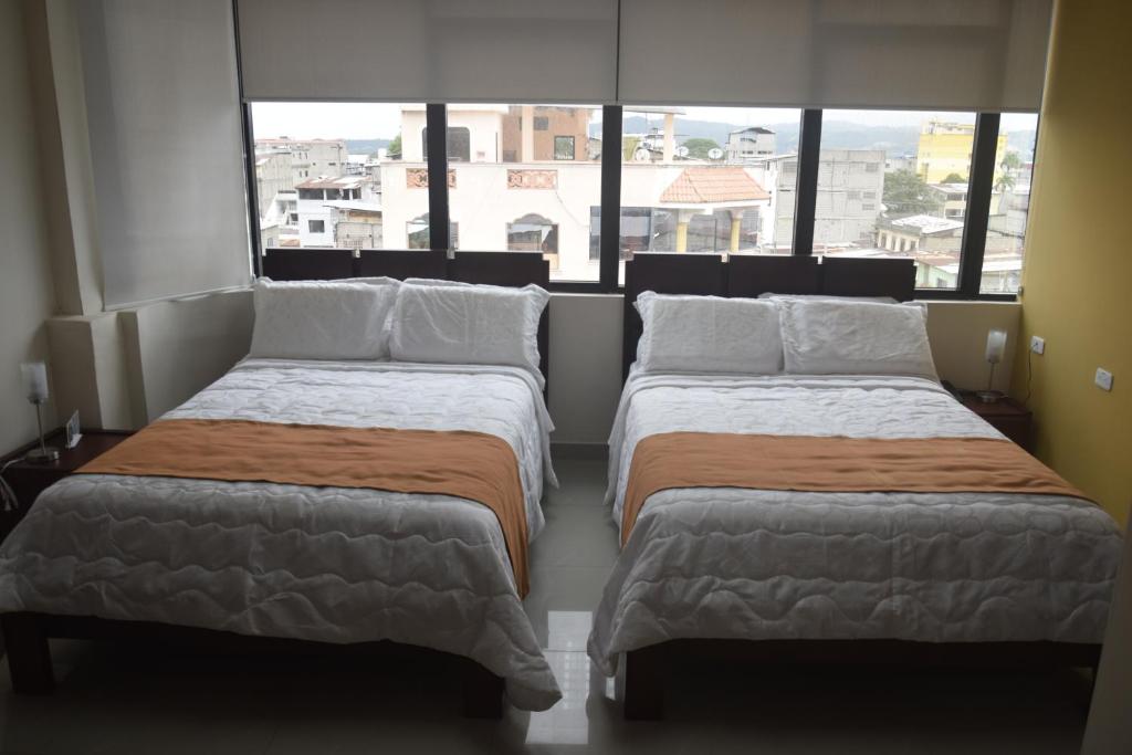 Postel nebo postele na pokoji v ubytování Olan´s Hotel Group
