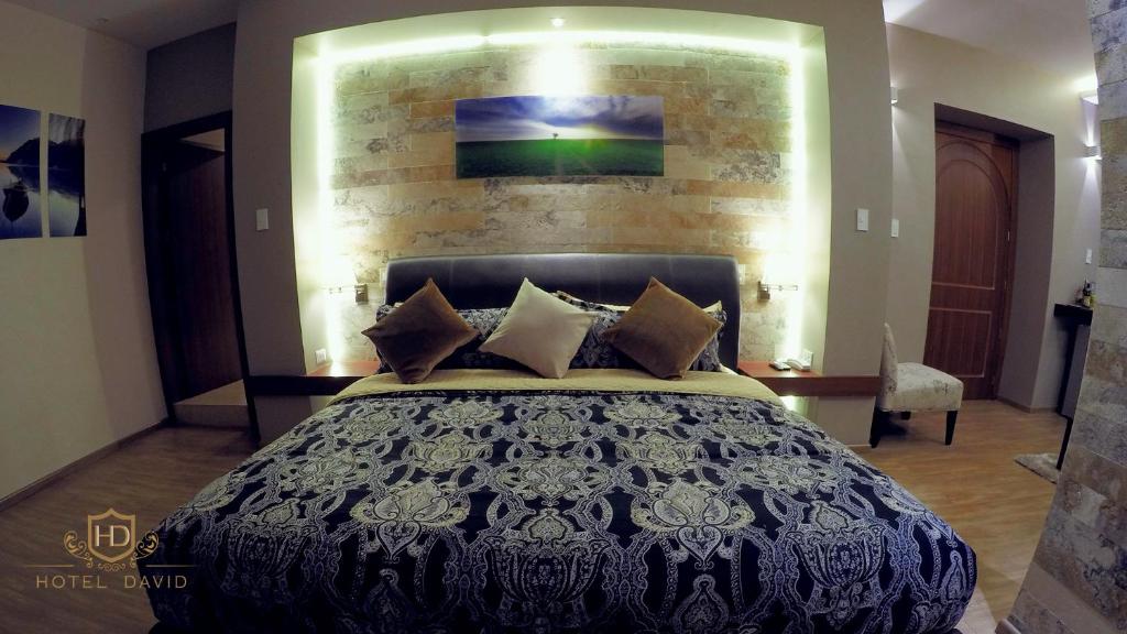 Postel nebo postele na pokoji v ubytování Hotel David