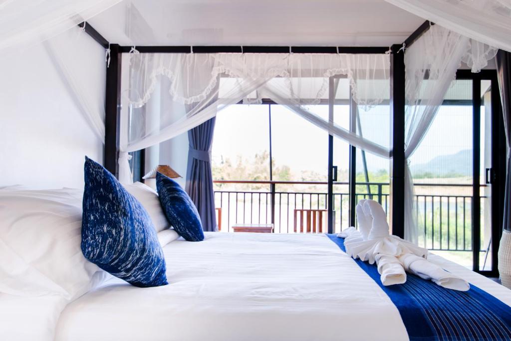 Postel nebo postele na pokoji v ubytování Phuruakeeree Resort