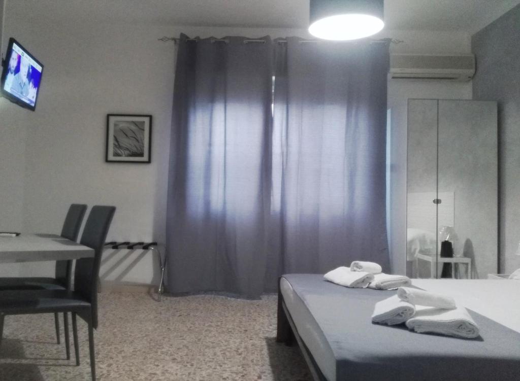 Postel nebo postele na pokoji v ubytování ALGHERO SEASIDE Guest House - Affittacamere