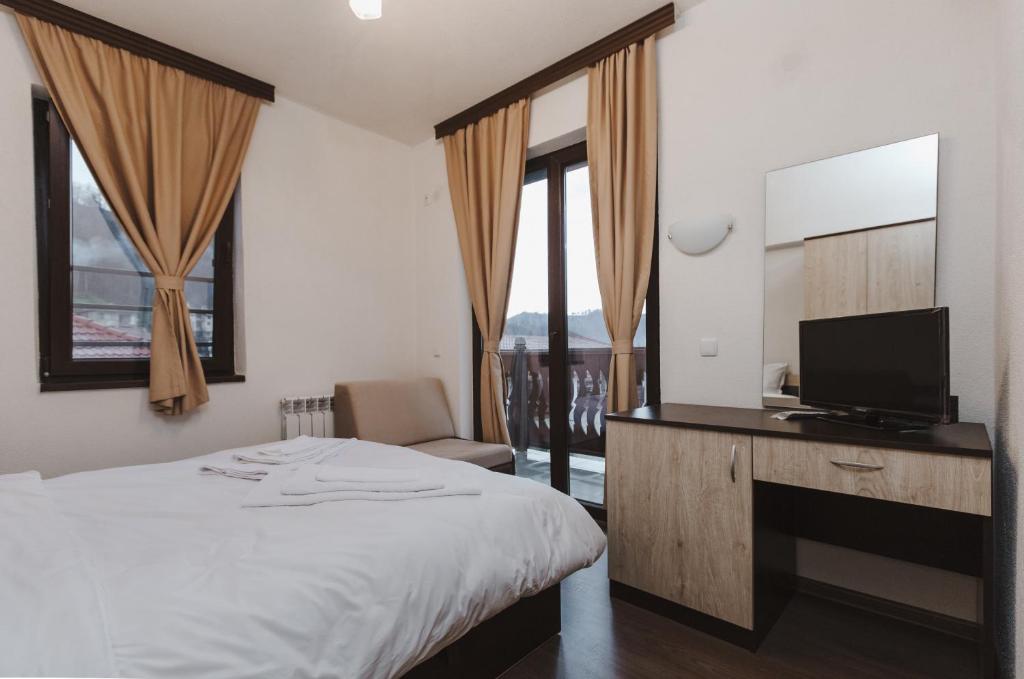 Postel nebo postele na pokoji v ubytování Zlatograd 2 Iosifova Guest House