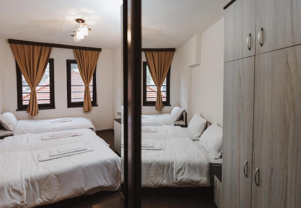 Postel nebo postele na pokoji v ubytování Zlatograd 2 Iosifova Guest House