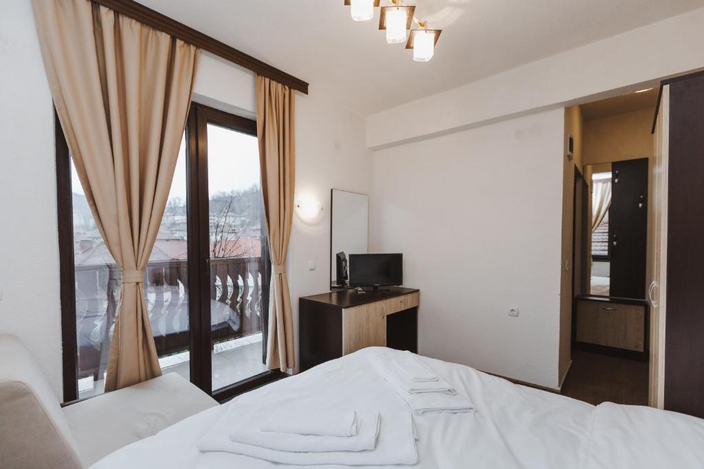 Postel nebo postele na pokoji v ubytování Zlatograd 2 Iosifova Guest House