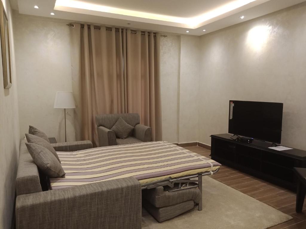 TV a/nebo společenská místnost v ubytování Le Park Hotel