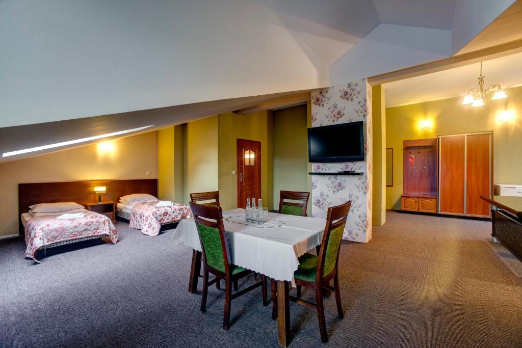 Postel nebo postele na pokoji v ubytování Hotel i Restauracja Bona