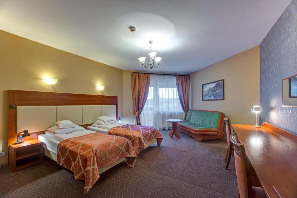 Postel nebo postele na pokoji v ubytování Hotel i Restauracja Bona
